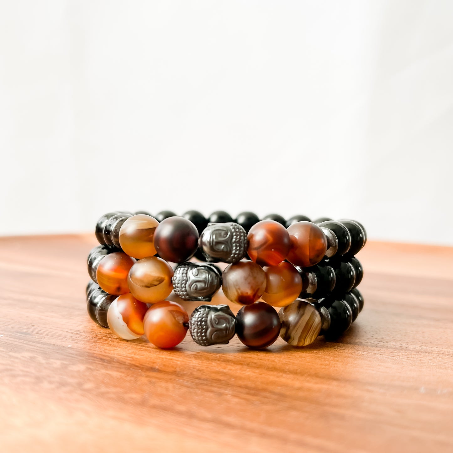 VIII. Shiny Black Obsidian, Brown Striped Agate and Hematite Buddha