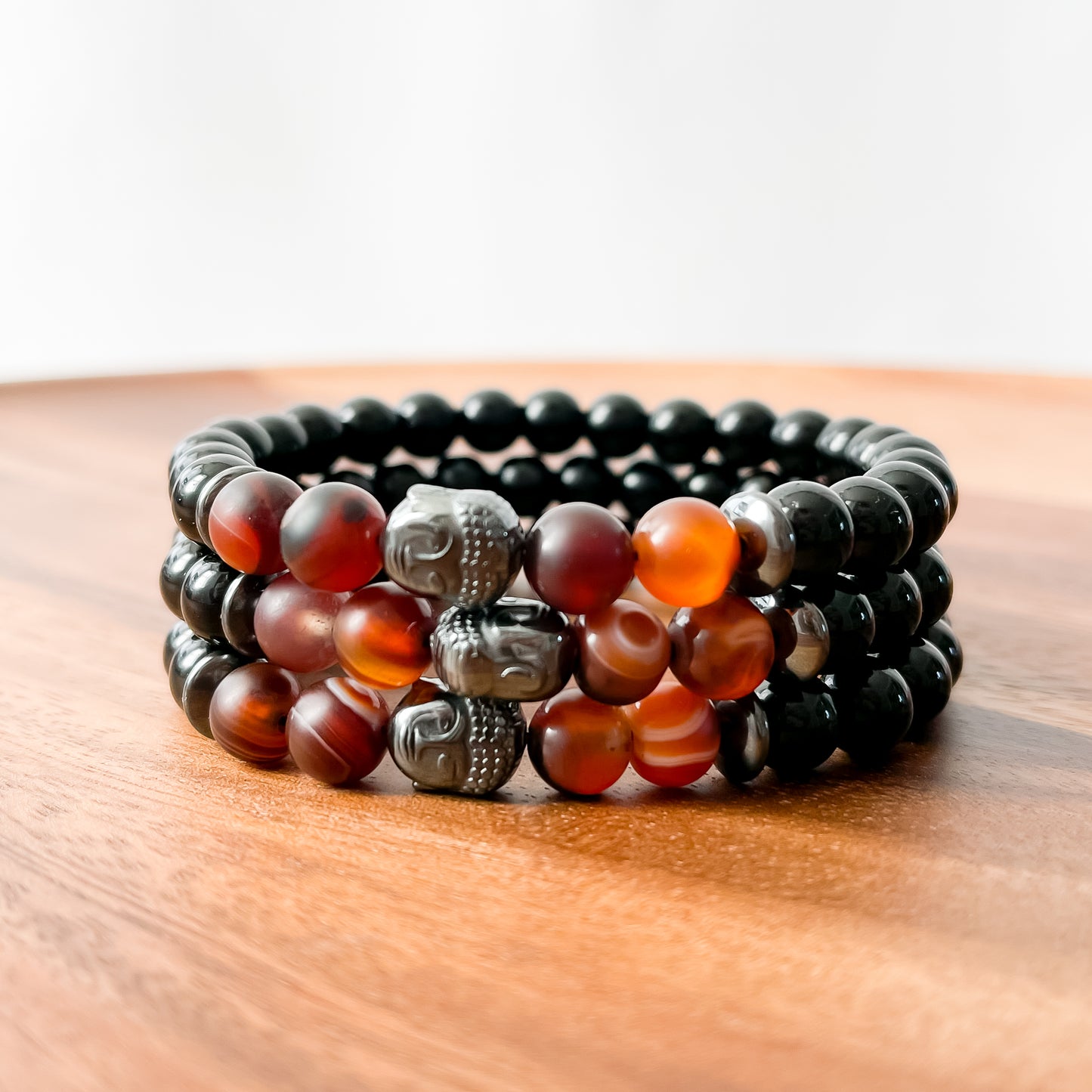 VIII. Shiny Black Obsidian, Brown Striped Agate and Hematite Buddha