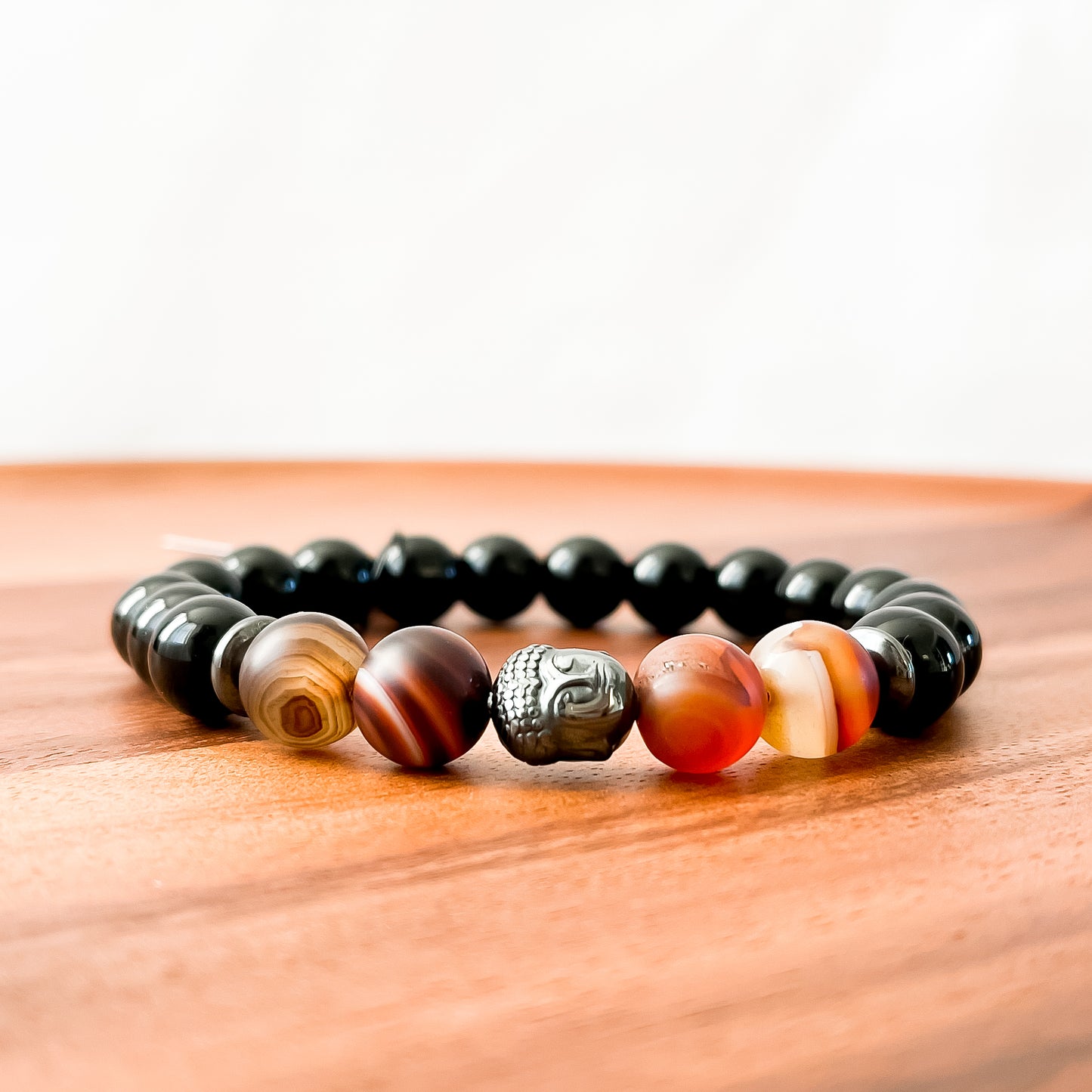 VIII. Shiny Black Obsidian, Brown Striped Agate and Hematite Buddha