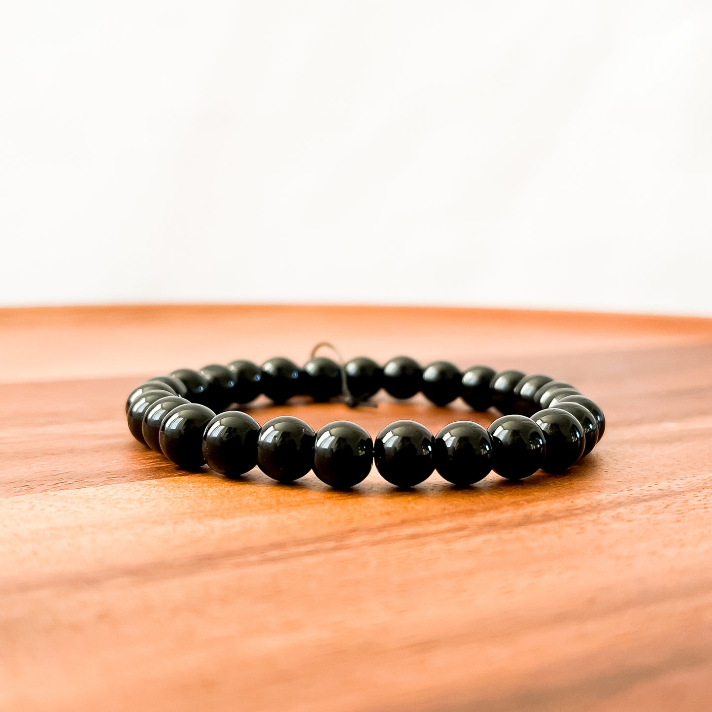 I. Shiny Black Obsidian Bead Bracelet