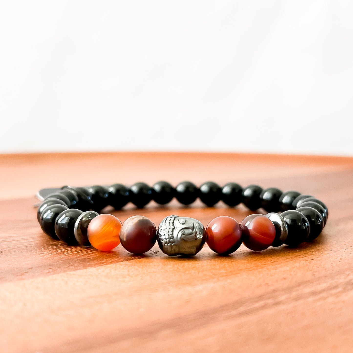 VIII. Shiny Black Obsidian, Brown Striped Agate and Hematite Buddha